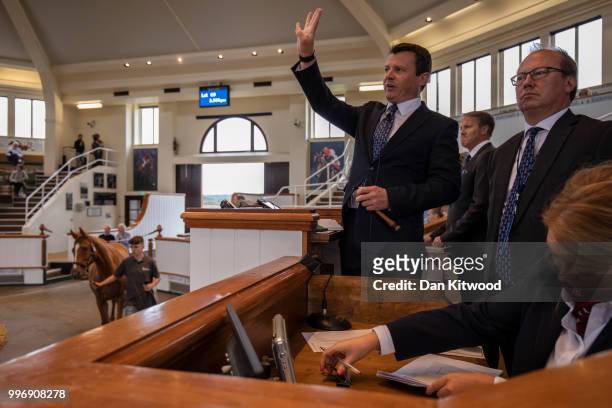 Tattersalls auctioneers during the 'Tattersalls' July Sale on July 11, 2018 in Newmarket, England. Founded in 1766 Tattersalls is Europes leading...