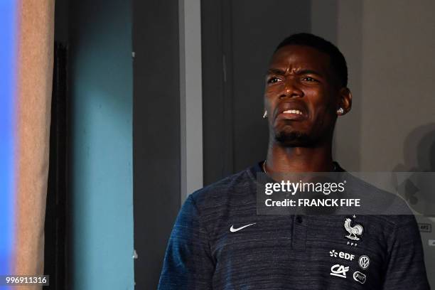 France's midfielder Paul Pogba arrives for a press conference at the press centre in Istra, west of Moscow, on July 12 ahead of their Russia 2018...