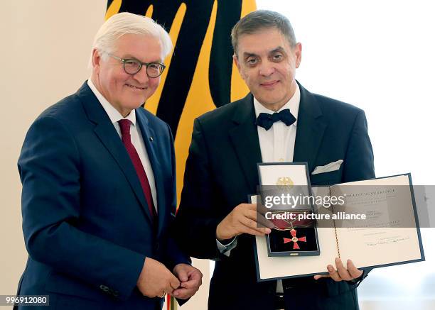 German President Frank-Walter Steinmeier presents the Order of Merit of the Federal Republic of Germany to the head of the Central Council of German...