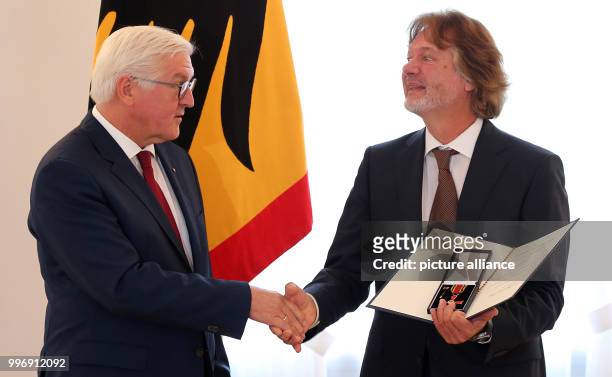 German President Frank-Walter Steinmeier presents the Order of Merit of the Federal Republic of Germany to environmentalist and documentary maker...