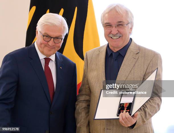 German President Frank-Walter Steinmeier presents the Order of Merit of the Federal Republic of Germany to Stefan Romey from Hamburg at Schloss...