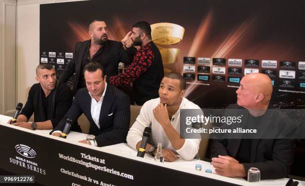 Boxing promoter Ahmet Oner gestures towards one of Eubank's staff and is held back by members of his team, at a press conference ahead of the World...