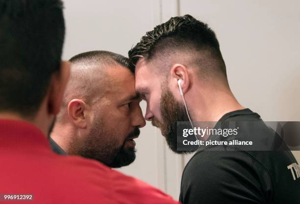 Boxing promoter Ahmet Oner and a member of Eubank Jr.'s staff face off at a press conference ahead of the World Boxing Super Series super...