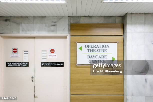 Sign directs to the operation theater and the daycare centre at the Tun Hussein Onn National Eye Hospital in Petaling Jaya, Selangor, Malaysia, on...