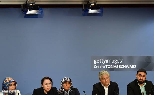 German lawyer Mehmet Daimagueler , lawyer Seda Basay and relatives of German National Socialist Underground neo-Nazi network's first alleged victim...