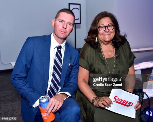 Fern Mallis and Guest attend the Todd Snyder S/S 2019 Collection during NYFW Men's July 2018 at Industria Studios on July 11, 2018 in New York City.