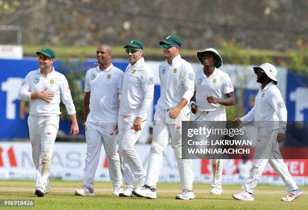 South Africa's Vernon Philander celebrates with teammates after dismissing Sri Lanka's batsman Dilruwan Perera during the first day of the opening...