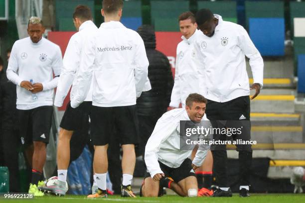 German national soccer player Thomas Mueller laughs during the final training of the German national soccer team before the World Cup qualification...