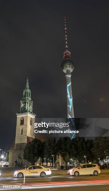 View of the illuminated TV tower during a test run for the 'Festival of Lights', taking place from 6 to 15 October, in Berlin, Germany, 4 October...