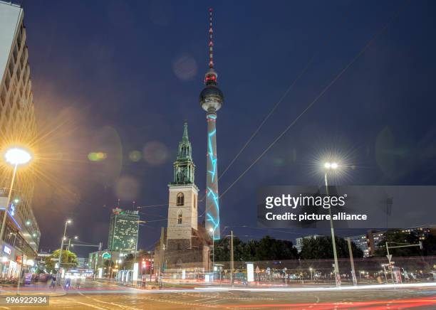 General view of the illuminated TV tower during a test run for the 'Festival of Lights' in Berlin, Germany, 04 October 2017. The festival starts on...
