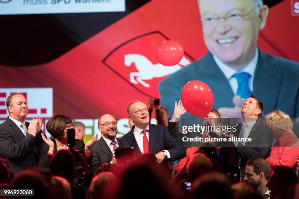 Chairman Martin Schulz and Lower Saxony's Premier Stephan Weil stand next to each other during an SPD campaign rally in Cuxhaven, Germany, 4 October...