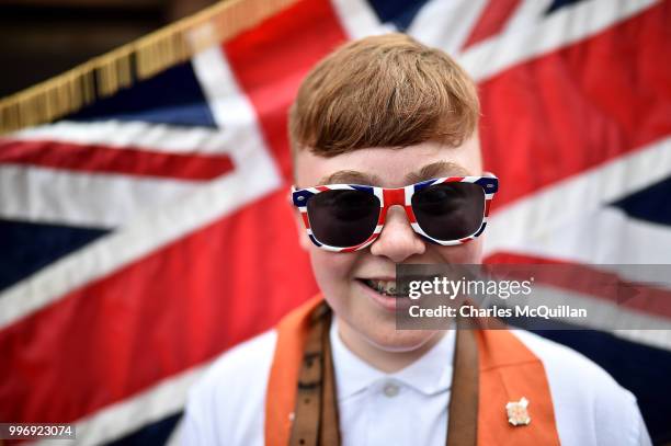 Young Orange man poses for a photograph during the annual 12th of July Orange march and demonstration taking place on July 12, 2018 in Belfast,...