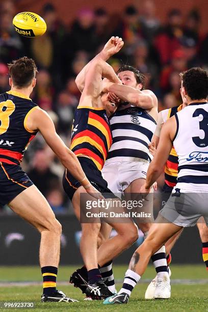 Rory Sloane of the Crows is tackled by Patrick Dangerfield of the Cats during the round 17 AFL match between the Adelaide Crows and the Geelong Cats...