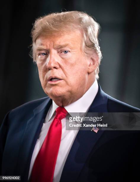 President Donald Trump walks through the new NATO Headquarters on the first day of the North Atlantic Treaty Organization summit in Brussels on July...