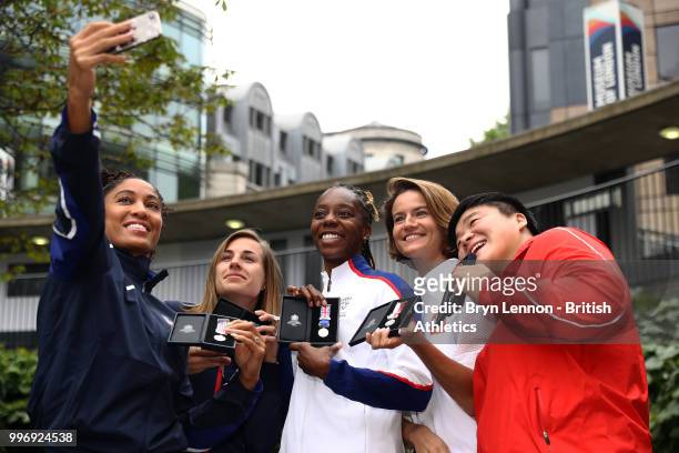 Queen Harrison of the USA takes a selfie with Ninon Guillon-Romarin of France, Lorraine Ugen of Great Britain, Anna Jagaciak-Michalska of Poland and...