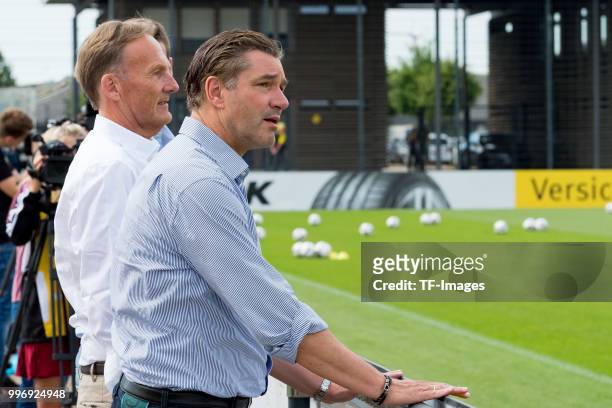 Hans-Joachim Watzke of Dortmund and Michael Zorc of Dortmund looks on during a training session at BVB trainings center on July 9, 2018 in Dortmund,...
