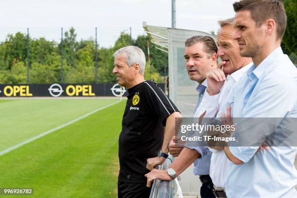 Head coach Lucien Favre of Dortmund, Michael Zorc of Dortmund, CEO Hans-Joachim Watzke of Dortmund and Sebastian Kehl of Dortmund look on during a...