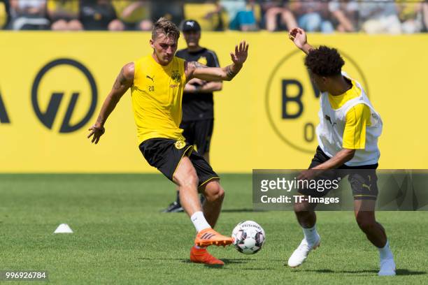 Maximilian Philipp of Dortmund and Jadon Sancho of Dortmund battle for the ball during a training session at BVB trainings center on July 9, 2018 in...