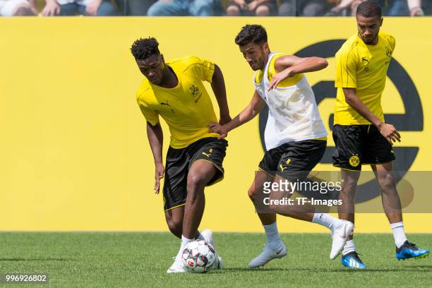 Dan-Axel Zagadou of Dortmund and Nuri Sahin of Dortmund battle for the ball during a training session at BVB trainings center on July 9, 2018 in...