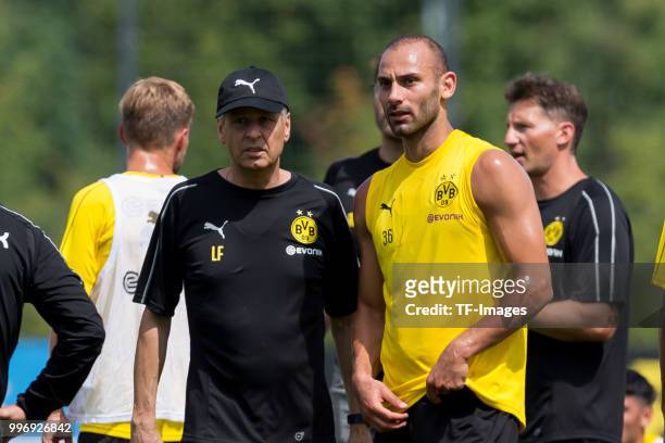 Head coach Lucien Favre of Dortmund and Oemer Toprak of Dortmund looks on during a training session at BVB trainings center on July 9, 2018 in...