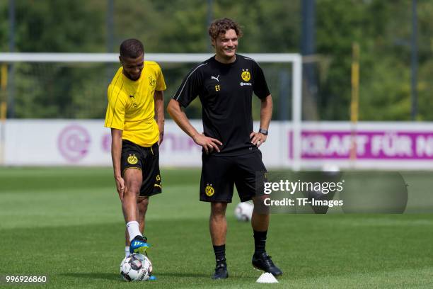 Jeremy Toljan of Dortmund speak with Assistant coach Edin Terzic of Dortmund during a training session at BVB trainings center on July 9, 2018 in...