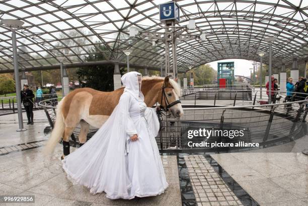 Dpatop - Sandra Olasz from a Spanish riding group passes through an underground station as part of a photo session of the fair "Hund & Pferd" in...