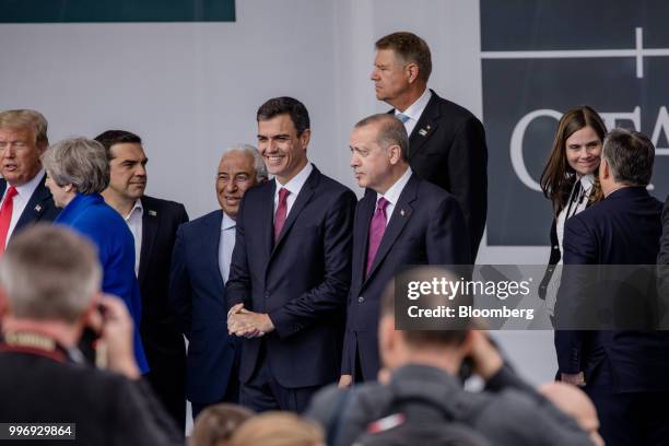 Pedro Sanchez, Spain's prime minister, center left, stands beside Recep Tayyip Erdogan, Turkey's president, as world leaders gather for a family...
