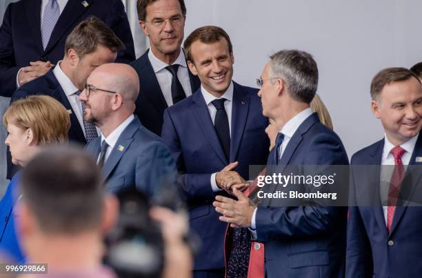 Emmanuel Macron, France's president, center, reacts as world leaders gather for a family photograph during the North Atlantic Treaty Organization...