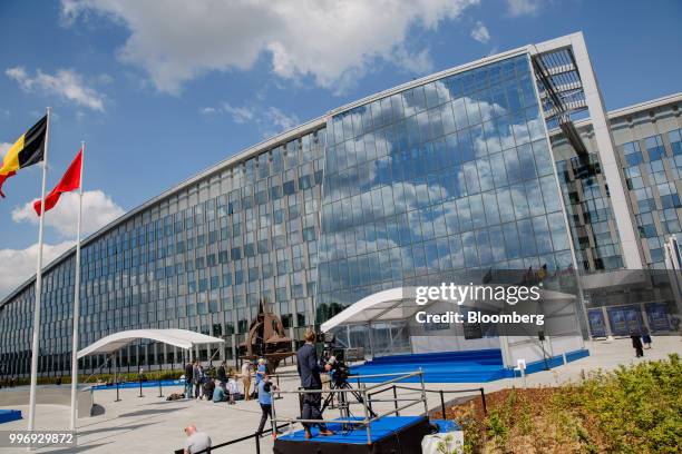 Attendees prepare for the welcoming ceremony of world leaders to the military and political alliance summit at the North Atlantic Treaty Organization...