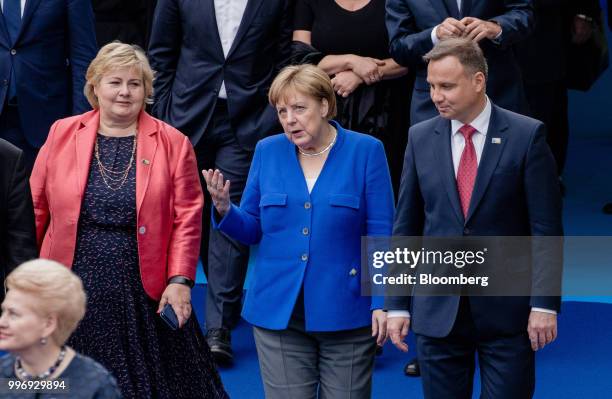 Erna Solberg, Norway's prime minister, left, Angela Merkel, Germany's chancellor, center, and Andrzej Duda, Poland's president, arrive for a working...