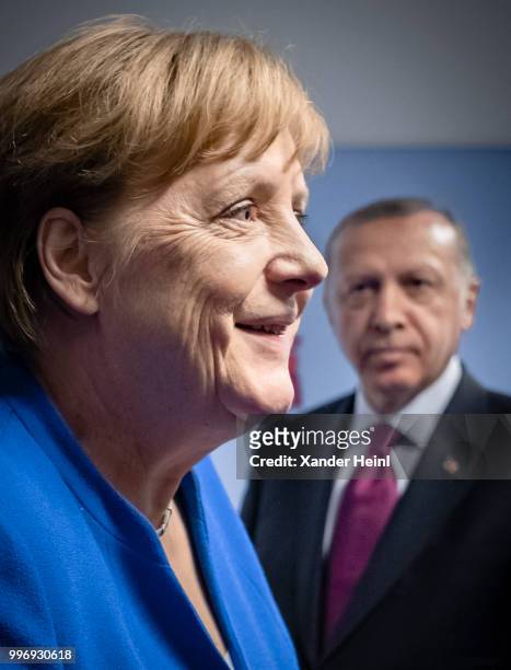 German Chancellor Angela Merkel meets Turkish President Recep Tayyip Erdogan on the first day of the North Atlantic Treaty Organization summit in...