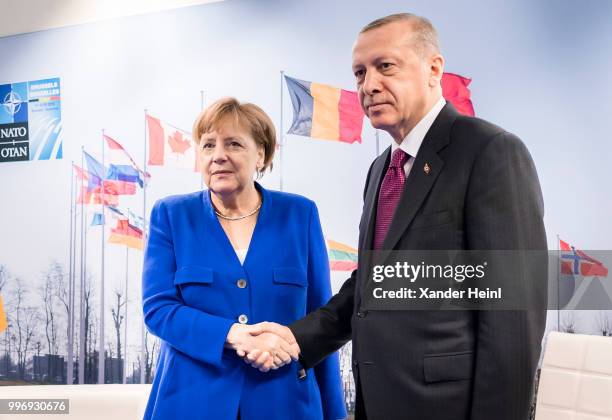 German Chancellor Angela Merkel meets Turkish President Recep Tayyip Erdogan on the first day of the North Atlantic Treaty Organization summit in...