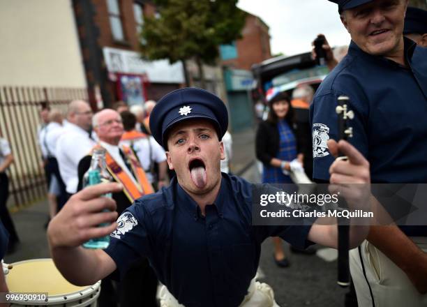 An Orange flute band member screams as the annual 12th of July Orange march and demonstration takes place on July 12, 2018 in Belfast, Northern...