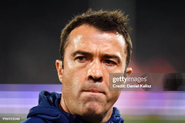 Cats head coach Chris Scott walks from the field at half time during the round 17 AFL match between the Adelaide Crows and the Geelong Cats at...