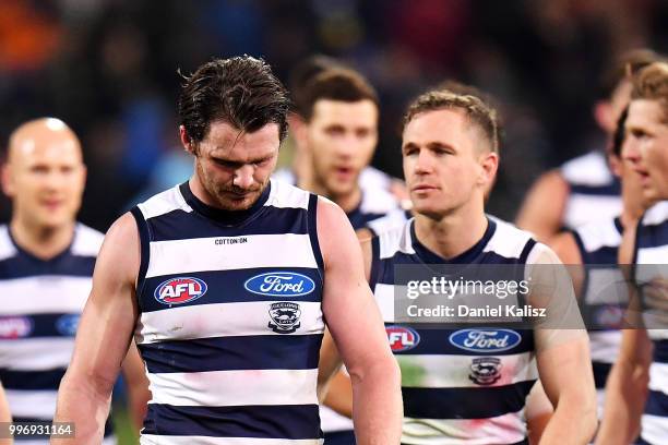 Patrick Dangerfield of the Cats and Joel Selwood of the Cats walk from the field at half time during the round 17 AFL match between the Adelaide...