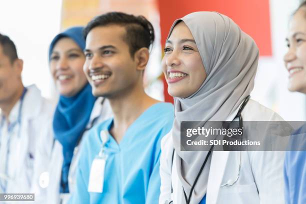 attentive healthcare providers attend medical conference - handsome muslim men stock pictures, royalty-free photos & images