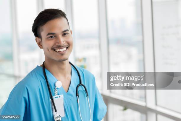 ritratto di medico maschio malese - asian male smiling foto e immagini stock