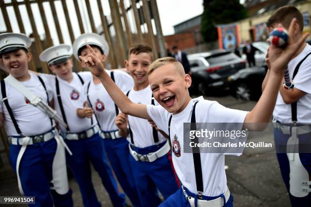 Young band members show off and pose as the annual 12th of July Orange march and demonstration takes place on July 12, 2018 in Belfast, Northern...