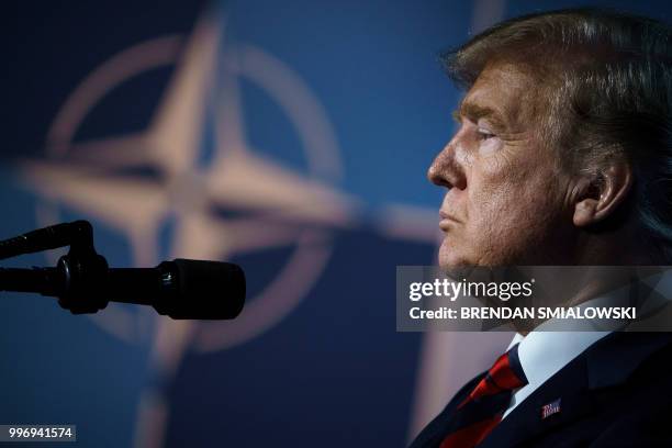 President Donald Trump pauses as he addresses a press conference on the second day of the North Atlantic Treaty Organization summit in Brussels on...