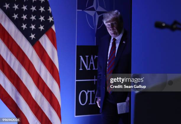 President Donald Trump arrives to speak to the media at a press conference on the second day of the 2018 NATO Summit on July 12, 2018 in Brussels,...
