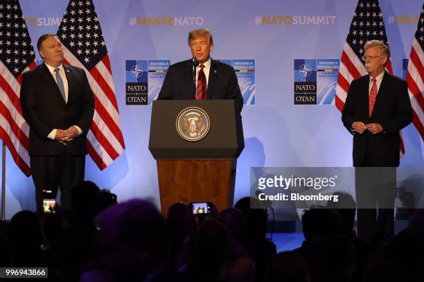 President Donald Trump, center, speaks flanked by Mike Pompeo, U.S. Secretary of state, left, and John Bolton, U.S. National security advisor, during...