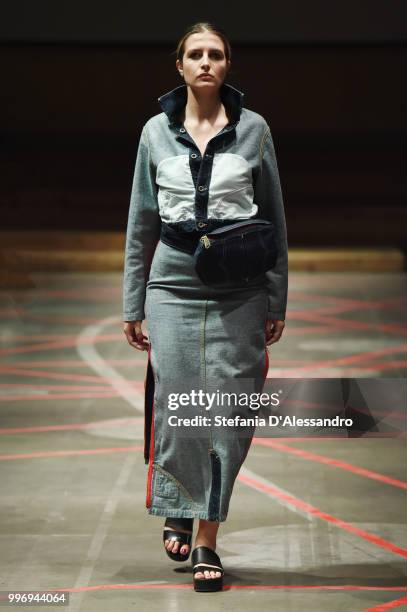 Model walks the runway during the 2017/2018 ISKO I-SKOOL Denim Awards fashion show on July 11, 2018 in Milan, Italy.