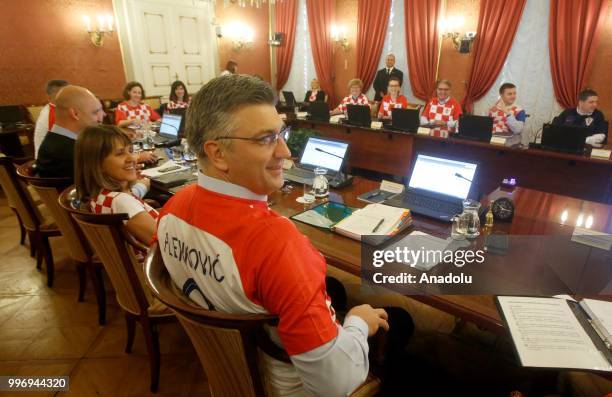 Prime Minister of Croatia Andrej Plenkovic and ministers in the cabinet attend a meeting in soccer team jerseys to mark Croatia National Football...