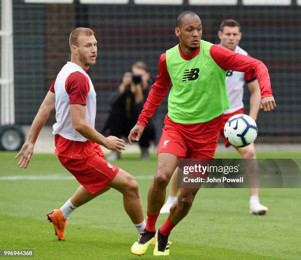 Ragnar Klavan and Fabinho of Liverpool during a training session at Melwood Training Ground on July 12, 2018 in Liverpool, England.