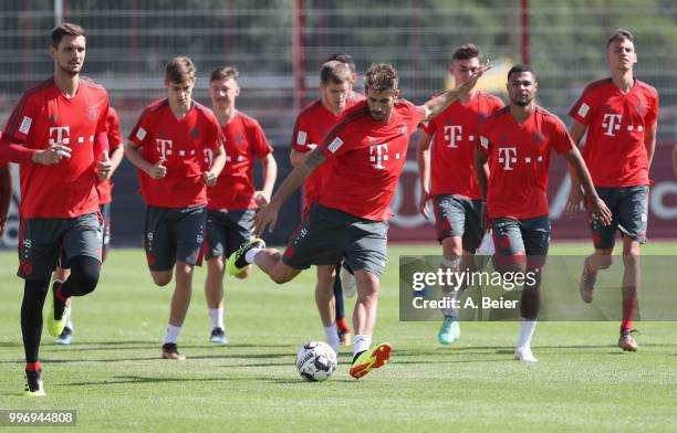 Javi Martinez of FC Bayern Muenchen warms up with teammates during a training session at the club's Saebener Strasse training ground on July 12, 2018...