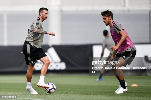 Federico Bernardeschi and Daniele Rugani during a Juventus training session at Juventus Training Center on July 12, 2018 in Turin, Italy.