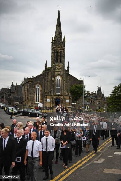 Mourners attend the funeral of Bay City Roller guitarist Alan Longmuir attends his funeral at Allan Church on July 12, 2018 in Bannockburn, Scotland....