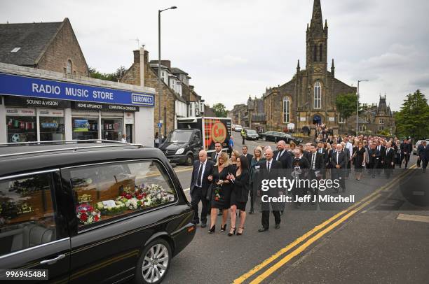 Mourners attend the funeral of Bay City Roller guitarist Alan Longmuir attends his funeral at Allan Church on July 12, 2018 in Bannockburn, Scotland....