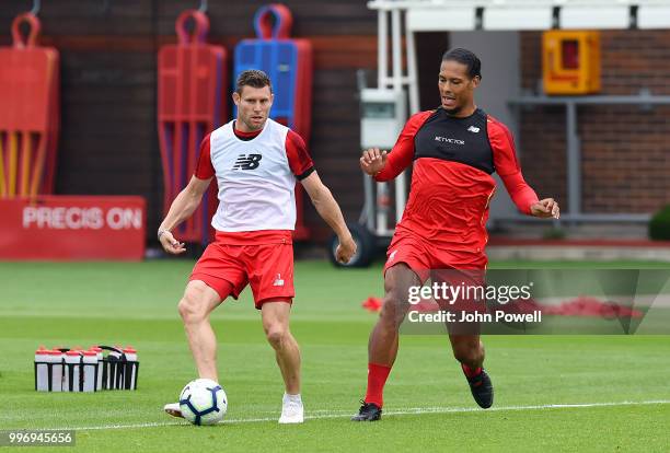 James Milner and Virgil van Dijk during a training session at Melwood Training Ground on July 12, 2018 in Liverpool, England.