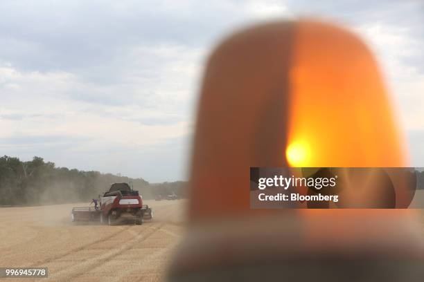 Torum combine harvester, manufactured by Rostselmash OJSC, drives through a field of wheat during the summer harvest on a farm operated by Ros Agro...